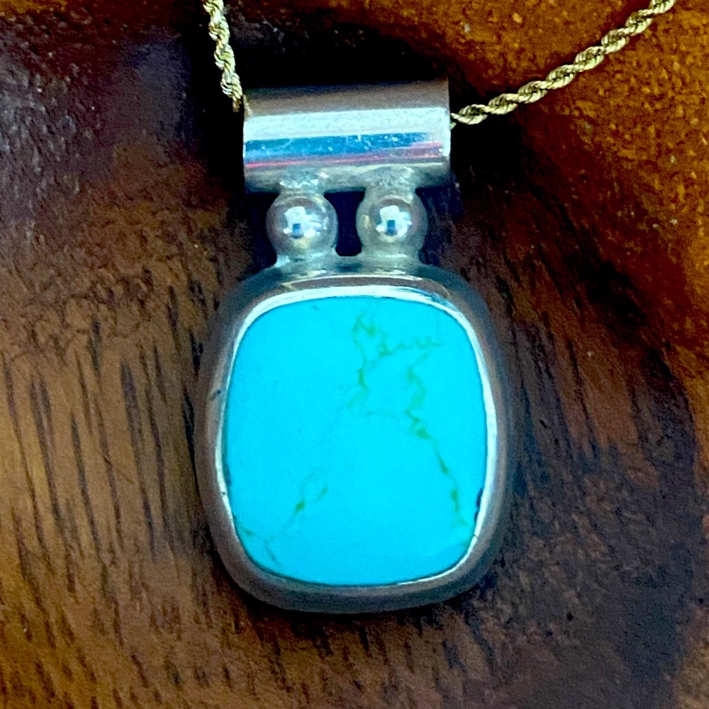 Beautiful turquoise and silver pendant.